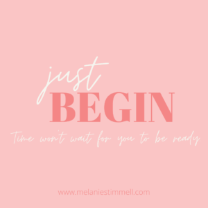 A motivational graphic with the phrase "just begin" in elegant white lettering on a pink background. Below, a subtitle reads "Time won't wait for you to be ready," and a website link