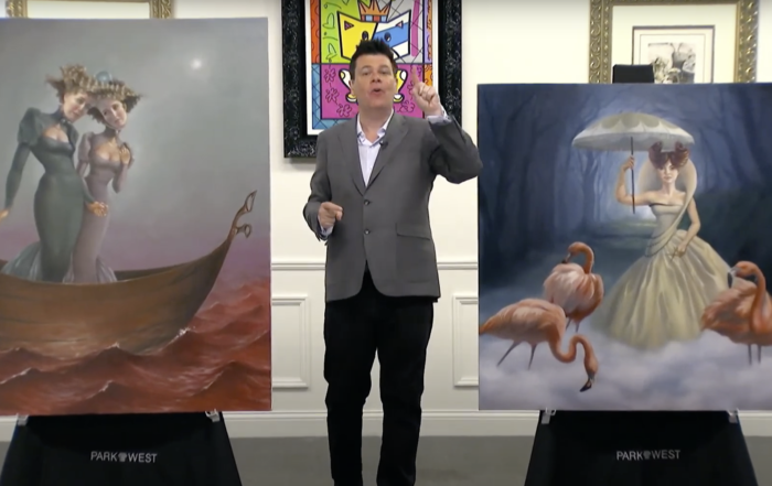 A man gestures animatedly between two surrealist paintings at an art gallery; one painting shows a woman in a boat with an octopus, the other, a woman with flamingos under an umbrella.