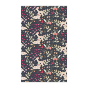 Illustrative patterned fabric featuring spotted deer, berries, and pine branches on a dark background. The fabric has a whimsical, nature-inspired design with a surrealistic festive feel.