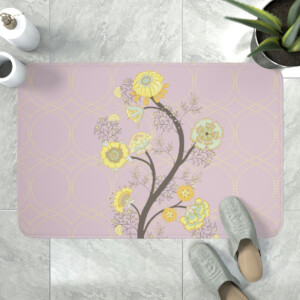 Decorative bath mat featuring a floral pattern with yellow and cream flowers on a lilac background, placed on a bathroom floor next to gray slippers and a green potted plant inspired by Surrealism.