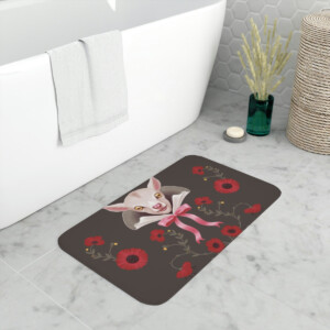 A stylish bathroom featuring a modern bathtub, with a decorative rug on the floor displaying a whimsical design of a pink sphinx cat surrounded by red flowers and green leaves.